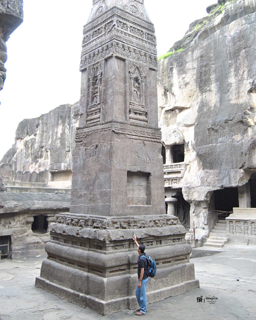 A rock pillar in front of the Kailash temple